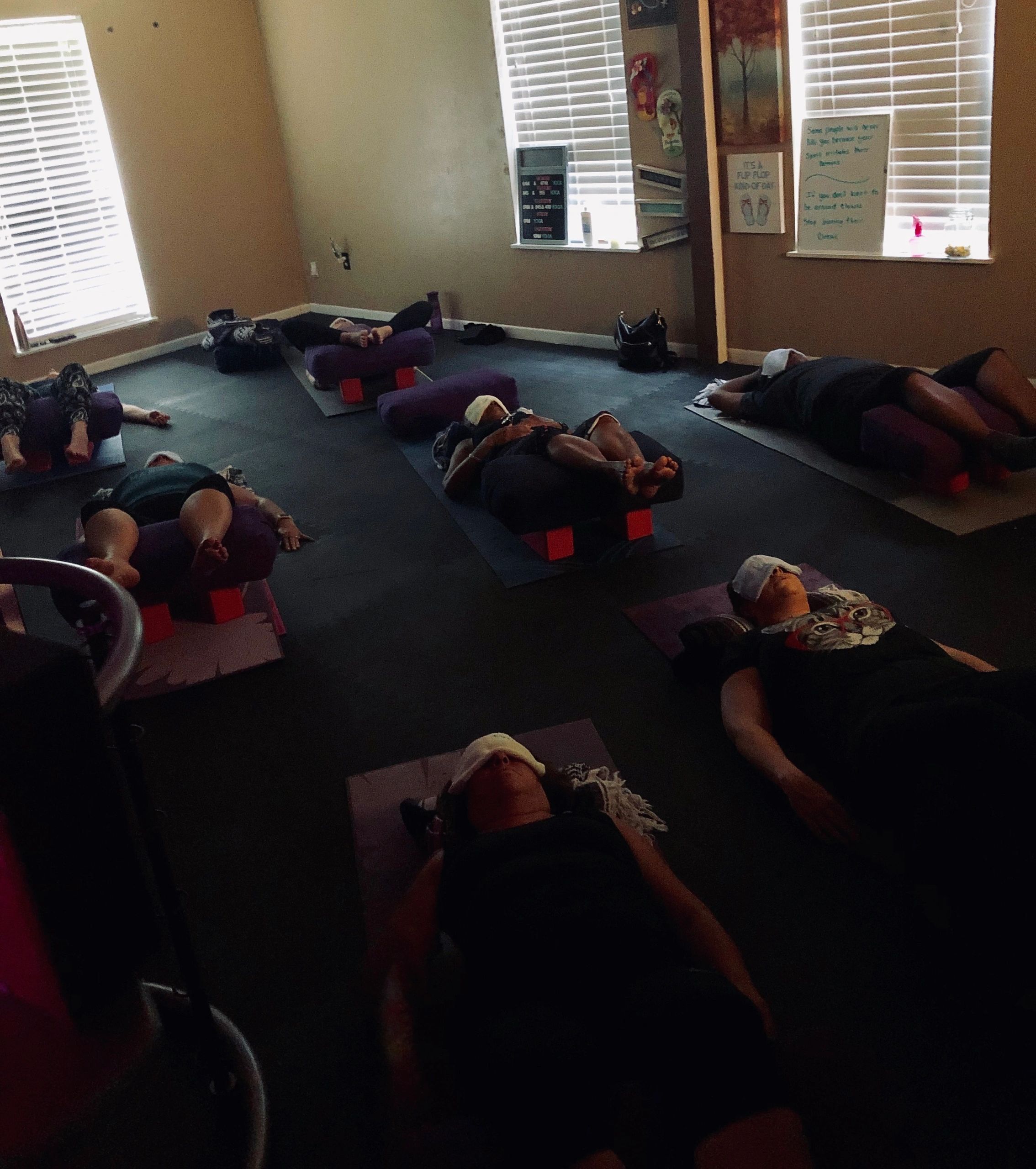 Yoga class with women on mats